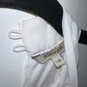 White top with black tie.